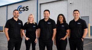 Certified Security Systems team standing outside their Palm Beach County security company office