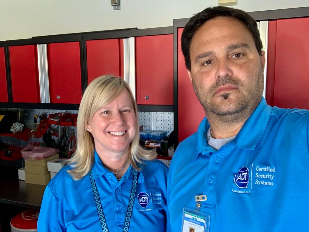 CSS Man and Wendy in the Royal Palm Beach garage where Certified Security Systems was founded in 2018