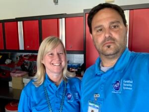 CSS Man and Wendy in the Royal Palm Beach garage where Certified Security Systems was founded in 2018