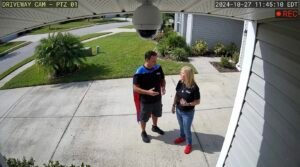 Security camera view of a woman and CSS Man having a conversation in a Royal Palm Beach driveway