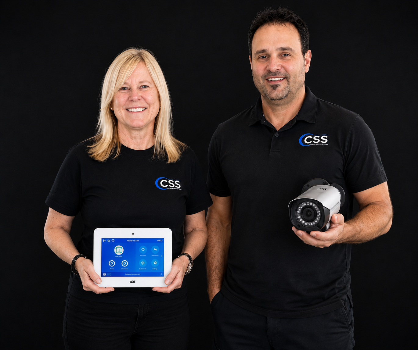 Lead technician and operations manager from Certified Security Systems standing together during a residential security system installation.